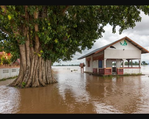 Flooded building beside the Mekong River in Si Phan Don, Laos