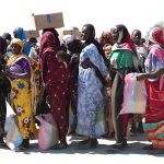 Sudanese refugees register for food aid in Adré, Chad