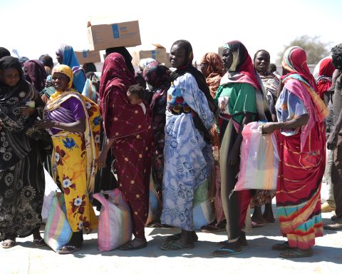 Sudanese refugees register for food aid in Adré, Chad